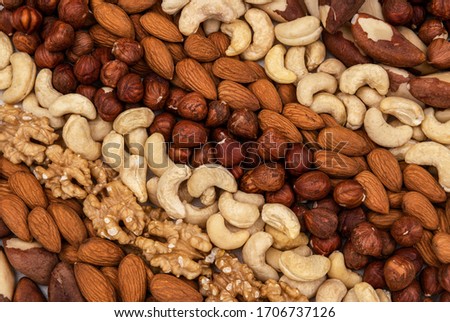 Stripes made of nuts, almond, cashew nuts, Brazil nut, walnut, hazelnut