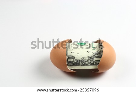 1 dollar in the broken egg.Hatching dollar.
