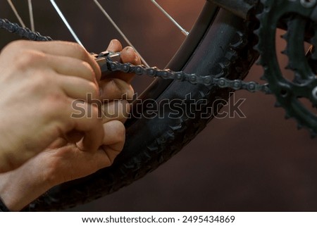 Similar – Image, Stock Photo Technician oiling bike chain in workshop