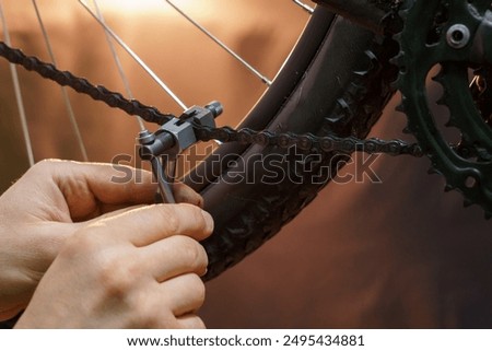 Similar – Image, Stock Photo Technician oiling bike chain in workshop