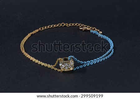 gold bracelet isolated on black