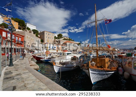 HYDRA, GREECE  JUNE 19 2015: Seafront with shops and boats in the harbour of Hydra on June 18 2015.
