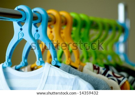 Child clothes and colorful hanger