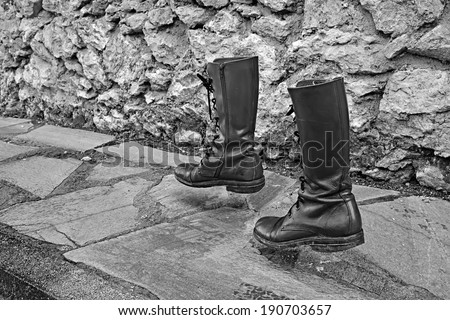 concept way of life, old boots walk alone