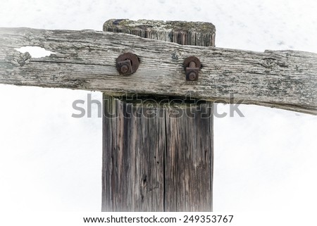 Old Fence Post in Snow