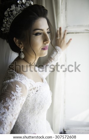Wedding portrait beautiful fiancee in white dress, soft light