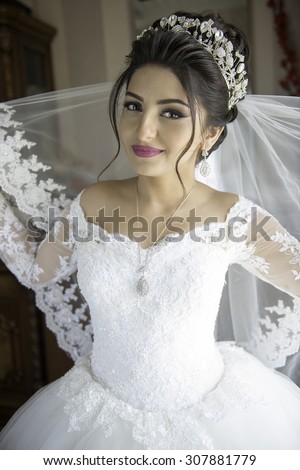 Wedding portrait beautiful fiancee in white dress, soft light