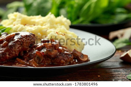 Salisbury Steak with mushroom gravy, mashed potatoes and spinach Сток-фото © 
