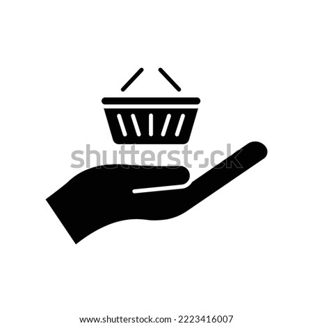 Online shop glyph icon. Contains hand with shopping cart. icon illustration related to e commerce shop. Simple vector design editable. Pixel perfect at 32 x 32