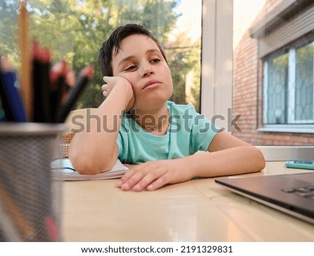 Similar – Image, Stock Photo Tired kid browsing laptop at home