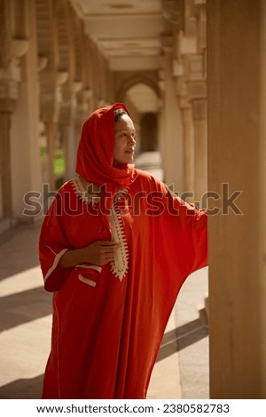 Similar – Image, Stock Photo Gorgeous woman touching columns in park