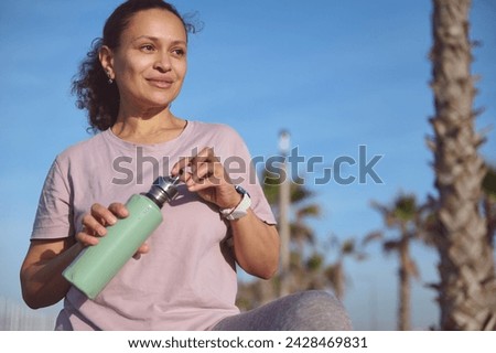 Similar – Image, Stock Photo Attractive female runner taking break after jogging outdoors