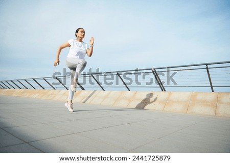 Similar – Image, Stock Photo Woman running fast along street in city