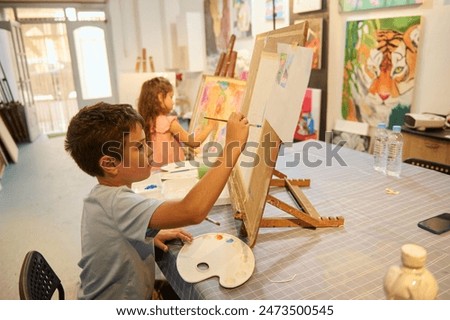 Similar – Image, Stock Photo Kid drawing on canvas at home