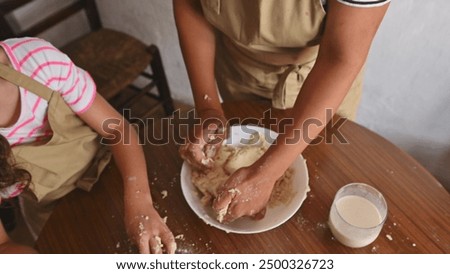 Similar – Image, Stock Photo Siblings kneading dough in kitchen