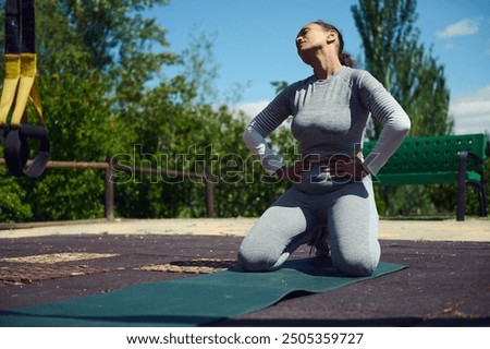 Similar – Image, Stock Photo young woman kneeling on floor feeding snacks to her cat