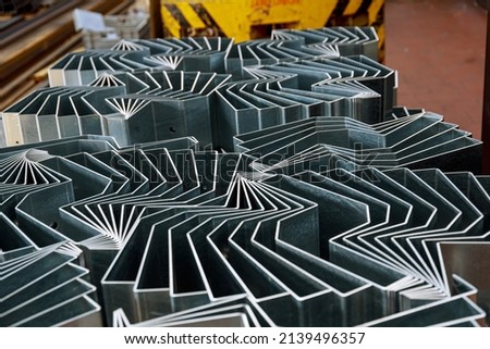 The finished product after bending on a sheet metal bending machine. Bending of various products at the metalworking plant. Stockfoto © 
