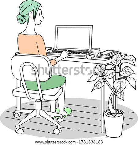 A woman working at home with a personal computer
