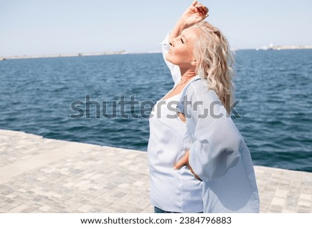 Similar – Foto Bild Frau in Jeans am Strand stehend