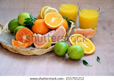 different varieties of fruits in a basket and fruit juice
