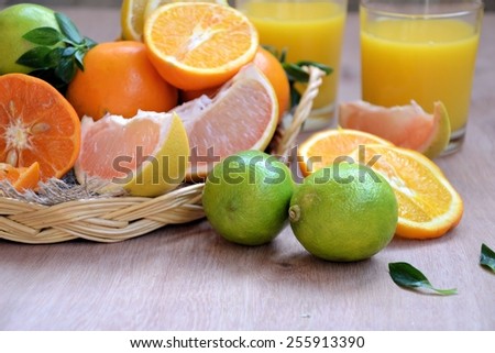 different varieties of fruits in a basket and fruit juice