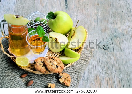 apples and apple juice on a wooden table . organic food