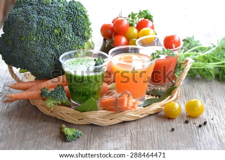 summer smoothies and organic vegetables on a wooden background, background for text or logo,concept veggie food