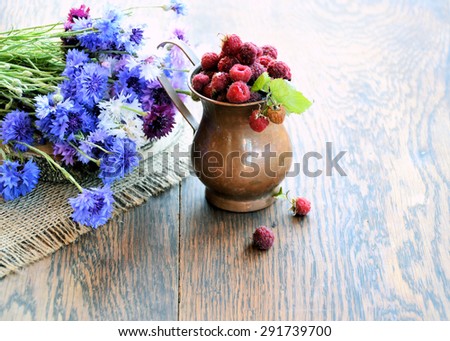 cornflowers flowers and   raspberries