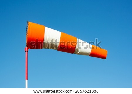 Similar – Image, Stock Photo weather change wind sock