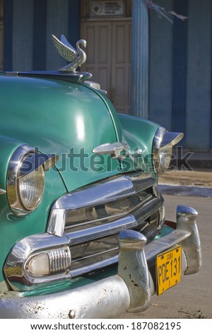 Vinales, Cuba - December 26, 2010; Front of classic aqua green pre-revolution car.  Past international embargoes have meant Cuba has maintained many pre-revolutions vehicles.