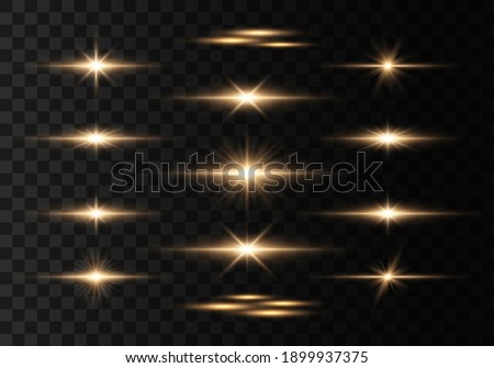 Bright gold flashes and glares. Bright rays of light. Set of flashes, Lights and Sparkles on a transparent background. Abstract golden lights isolated  Glowing lines. 