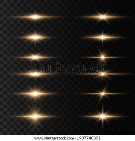 Bright gold flashes and glares. Set of flashes, Lights and Sparkles on a transparent background. Abstract golden lights isolated  Bright rays of light. Glowing lines. 