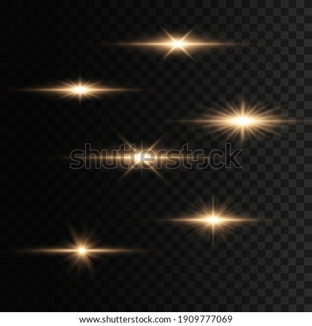 Set of flashes, Lights and Sparkles on a transparent background. Bright gold flashes and glares. Abstract golden lights isolated  Bright rays of light. Glowing lines. 
