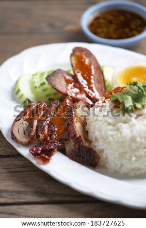 pork grill and rice with sweet sauce in thai food