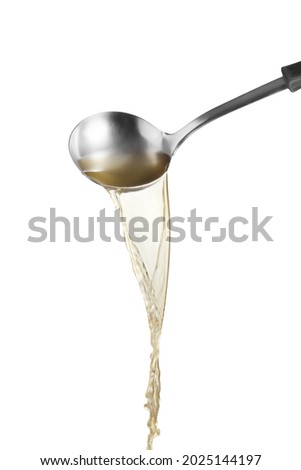 Dipper pouring noodle soup isolated on white background, Soup for sukiyaki from chicken and fish Stock foto © 