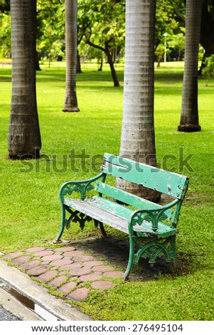 wooden green chair in park
