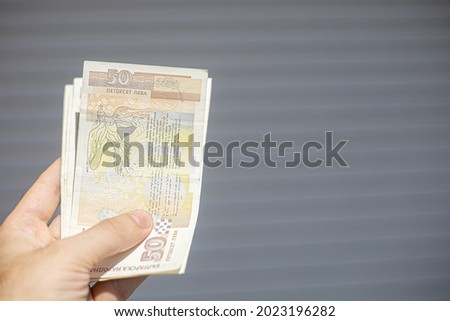 hand holdin a stack of 50 lev bills. Bulgarian currency Photo stock © 