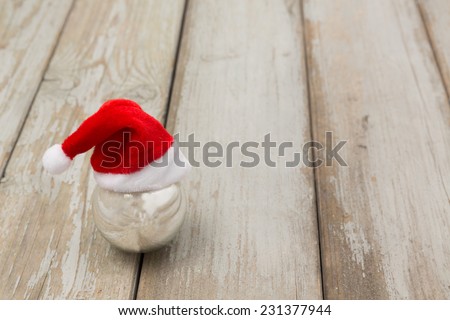 waiting for christmas - funny single silver christmas ball wearing santas hat