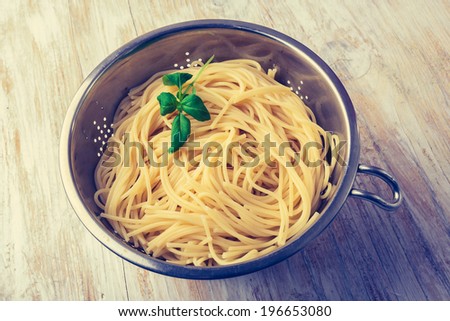 vintage photo of cooked pasta in the strainer