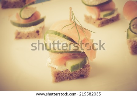 vintage photo of small sandwiches with salmon and cream cheese
