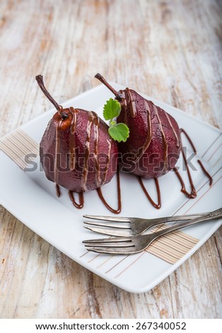 Pears cooked in red wine with chocolate