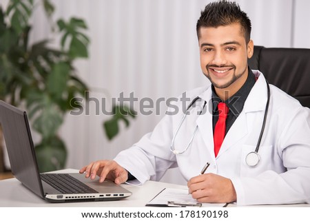 portrait of a young Indian doctor