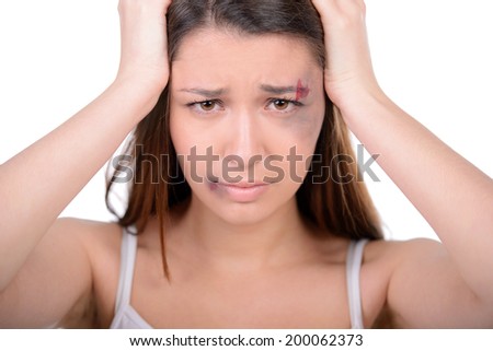 Portrait of thoughtful woman with bruise on her face. Looking away with sad look