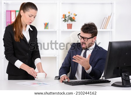 I asked to bring me tea! Stressed young businessman shouting at his secretary holding a cup of coffee