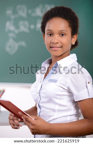 African American student doing math problems on the chalkboard