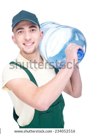 Water delivery courier is holding a bottle on his shoulder.