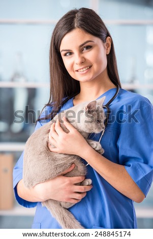 Portrait of a young female doctor with a cute beautiful cat.