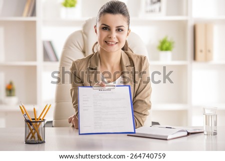 Young beauty businesswoman giving a resume in office.