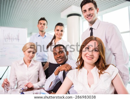 Business team at a meeting in a modern office environment.