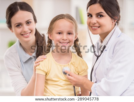 Mother and her little daughter visiting doctor\'s office.